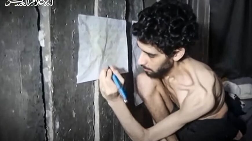 Screengrab from a video released by the armed wing of Palestinian group Hamas showing Israeli hostage Evyatar David in a Gaza tunnel