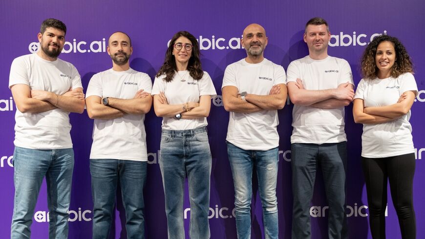 Nour Al Hassan, founder and CEO of Tarjama (C), and members of the Tarjama team promoting Arabic.AI, the firm's new platform offering business solutions, 2025.