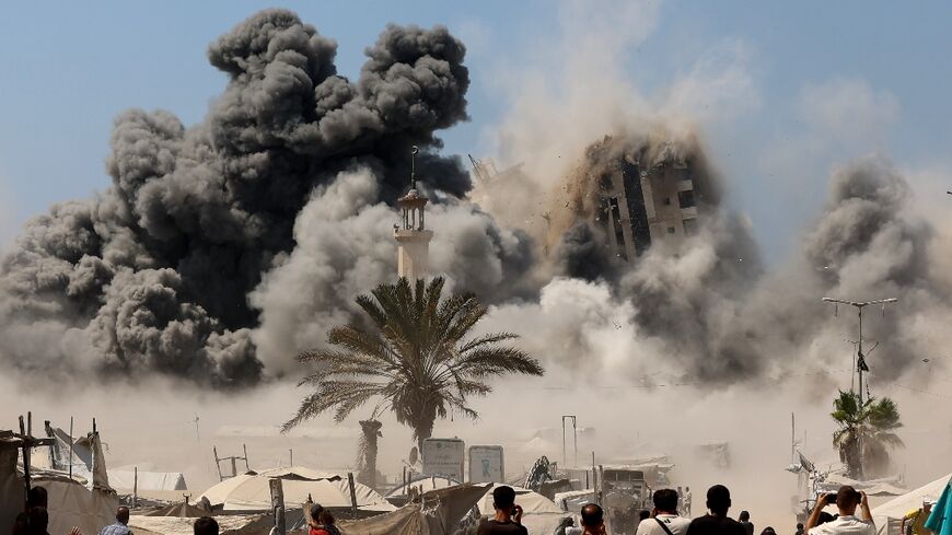 Mushtaha Tower in Gaza City collapses after being hit by an Israeli air strike on Friday
