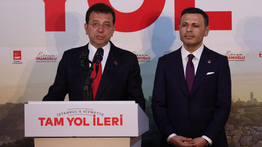 FILE PHOTO: Istanbul Mayor Ekrem Imamoglu, mayoral candidate of the main opposition Republican People's Party (CHP), accompanied by CHP Istanbul Provincial Chairman Ozgur Celik, talks to media at his party's local headquarters in Istanbul, Turkey March 31, 2024. REUTERS/Murad Sezer/File photo