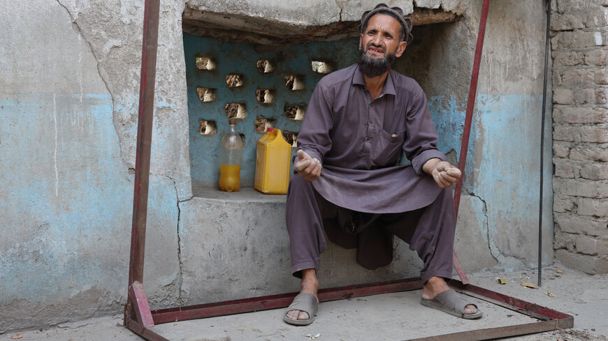 Abdul Ghafar, 52, sits at his partially damaged house as he speaks during an interview with Reuters, following a deadly earthquake in Bambakot village in Dera Noor district in Nangarhar province, Afghanistan September 6, 2025. REUTERS/Sayed Hassib