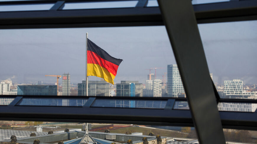 FILE PHOTO: German national flag flutters on top of the Reichstag building, that seats the Germany's lower house of parliament, the Bundestag, in Berlin, Germany, March 25, 2025. REUTERS/Lisi Niesner/ File Photo