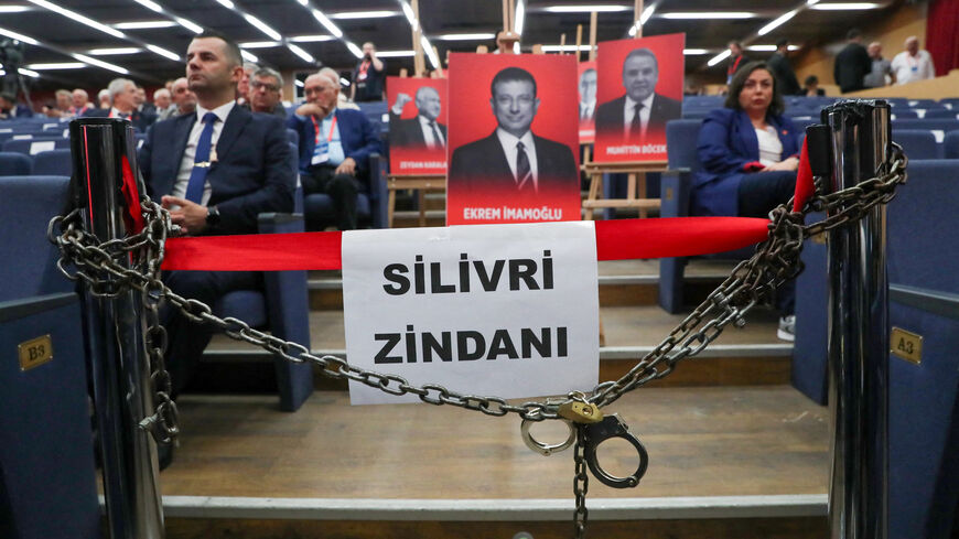 Portraits of jailed mayors, including one of Istanbul Mayor Ekrem Imamoglu displayed with symbolic props such as chains, handcuffs, and a banner referencing Silivri Prison, are presented as a political protest ahead of the opening session of Turkey's main opposition Republican People's Party (CHP) 22nd extraordinary congress in Ankara, Turkey, September 21, 2025. REUTERS/Cagla Gurdogan