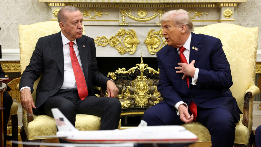 FILE PHOTO: U.S. President Donald Trump and Turkey's President Recep Tayyip Erdogan meet at the White House in Washington, D.C., U.S., September 25, 2025. REUTERS/Kevin Lamarque/File Photo