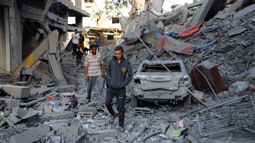 Palestinians inspect the site of Israeli strikes on houses at Shati (Beach) refugee camp, amid an Israeli military operation, in Gaza City, September 26, 2025. REUTERS/Ebrahim Hajjaj