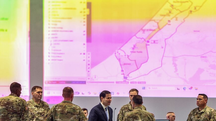 US Secretary of State Marco Rubio  speaks with US military personnel as he visits the Civil-Military Coordination Center in southern Israel