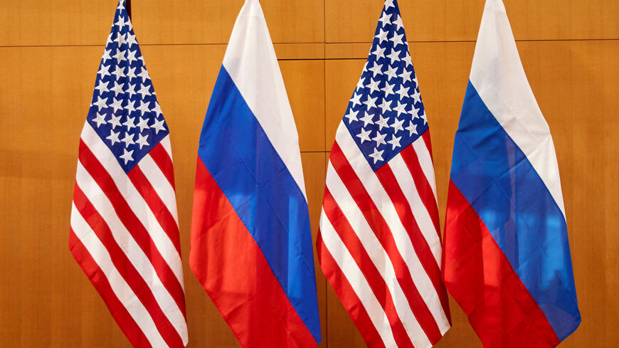 Russian and U.S. flags are pictured before talks between Russian Deputy Foreign Minister Sergei Ryabkov and U.S. Deputy Secretary of State Wendy Sherman at the United States Mission in Geneva, Switzerland January 10, 2022. REUTERS/Denis Balibouse
