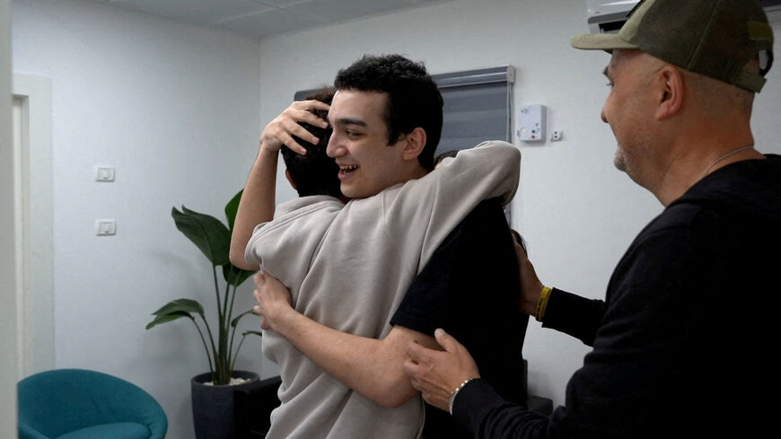 Edan Alexander, who has been released from captivity by Hamas, after he had been kidnapped during the deadly October 7, 2023 attack on Israel, embraces his brother as he reunites with his family in Reim, southern Israel, before flying to Tel Aviv May 12, 2025. GPO/Handout via REUTERS