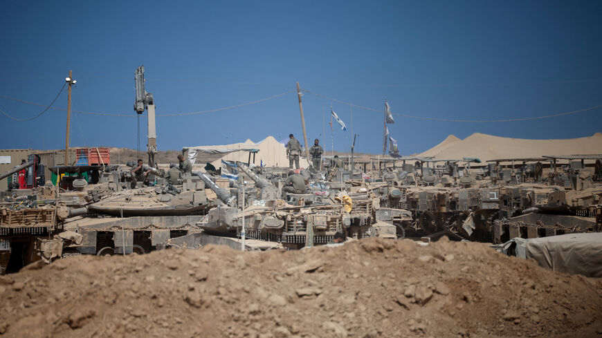 Israeli soldiers on military vehicles near the Israel-Gaza border, after a ceasefire between Israel and Hamas in Gaza went into effect, in Israel, October 10, 2025. REUTERS/Shir Torem