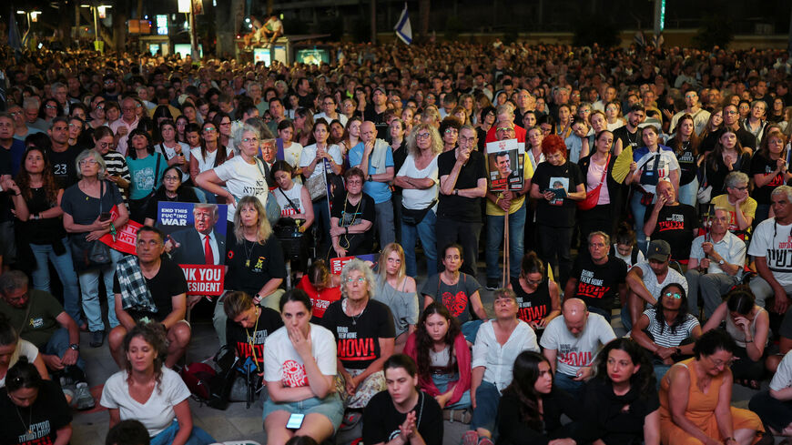 People gather in "Hostages square", after a ceasefire between Israel and Hamas in Gaza went into effect, in Tel Aviv, Israel, October 11, 2025. REUTERS/Hannah McKay