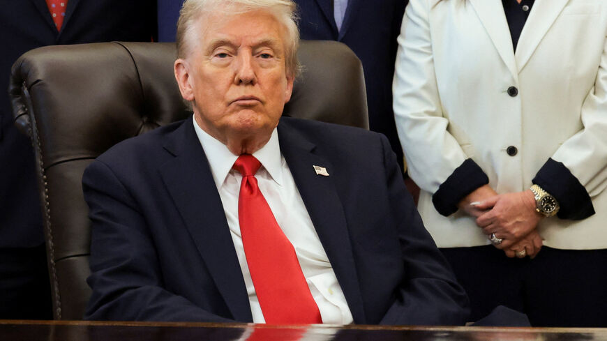U.S. President Donald Trump looks on during an event to make announcements on fertility treatment coverage, in the Oval Office at the White House in Washington, D.C., U.S., October 16, 2025. REUTERS/Jonathan Ernst
