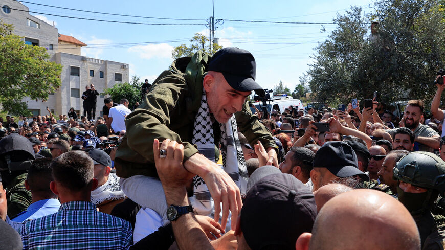 A freed Palestinian prisoner reacts after being released from an Israeli jail as part of a hostages-prisoners swap and a ceasefire deal in Gaza between Hamas and Israel, in Ramallah, in the Israeli-occupied West Bank, October 13, 2025. REUTERS/Mussa Qawasma