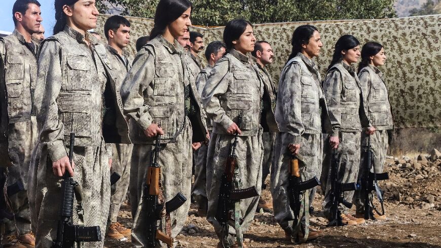 A first group of 25 PKK fighters who had left Turkey for northern Iraq were at the ceremony, among them eight women