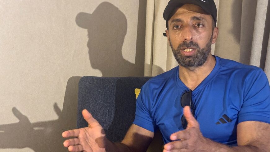 Murad Abu al-Rub, an exiled Palestinian prisoner in Egypt, speaks to AFP from his hotel room  