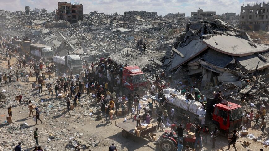 Aid trucks surrounded by desperate Palestinians in Gaza on October 12