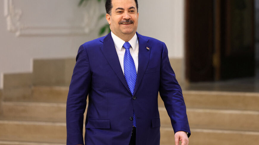 Iraqi Prime Minister Mohammed Shia al-Sudani walks before an interview with Reuters in Baghdad, Iraq November 3, 2025. REUTERS/Thaier Al-Sudani