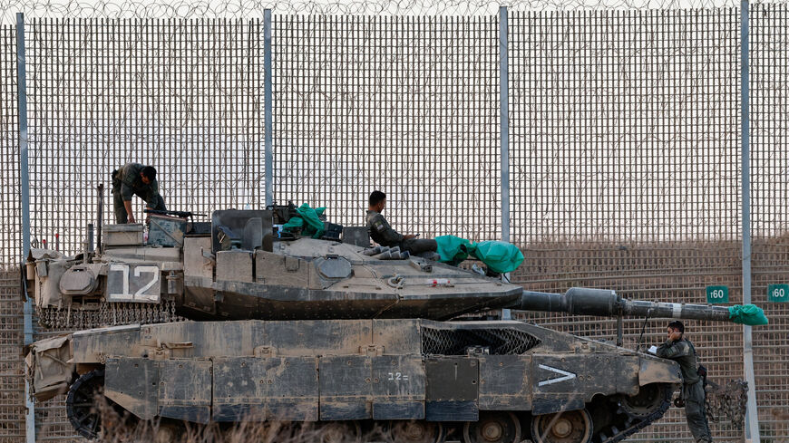 An Israeli tank stands on the Israeli side of the border with Gaza, in Israel, October 19, 2025. REUTERS/Amir Cohen