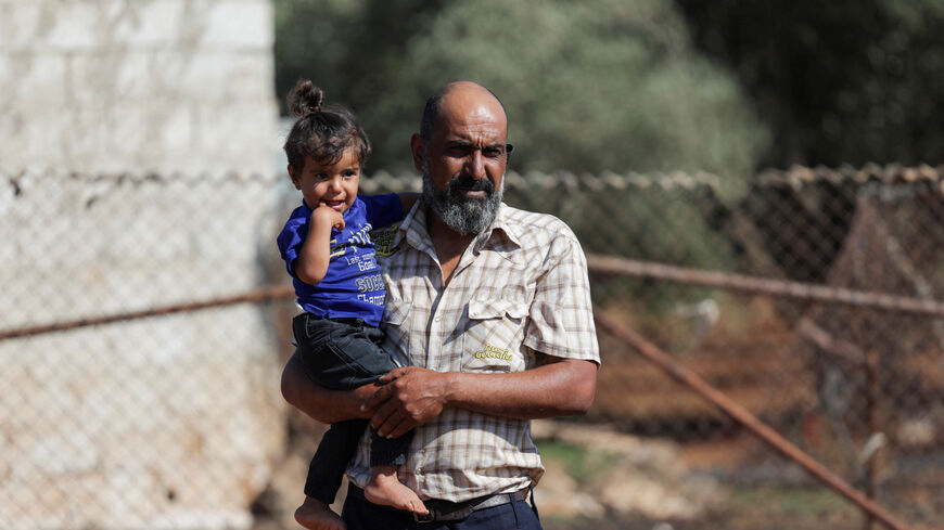Faisal Sbeih, 46, who fled sectarian fighting in Syria's Sweida province, stands outside his tent in the Daraa countryside, Syria, September 15, 2025. REUTERS/Khalil Ashawi