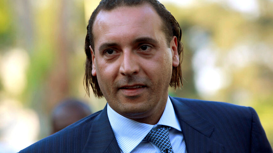 FILE PHOTO: Hannibal Gaddafi, son of Libyan leader Muammar Gaddafi, attends the signing agreement ceremony between Libya's Shipping Corporation and STX Europe to build a cruise ship, in Tripoli June 30, 2010.  REUTERS/Ismail Zitouny/File Photo