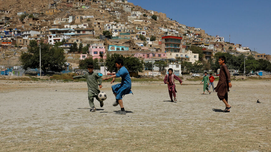Afghan children play football in a playground in Kabul, Afghanistan, September 10, 2024. REUTERS/Sayed Hassib