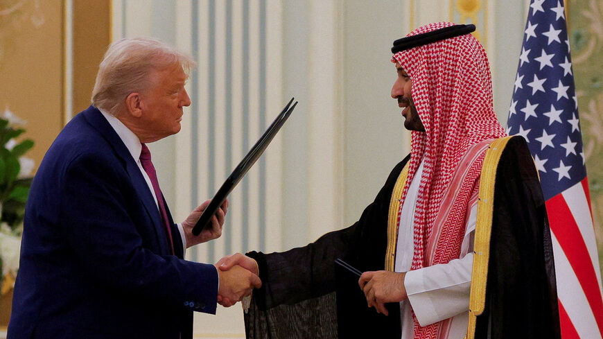 U.S. President Donald Trump and Saudi Crown Prince and Prime Minister Mohammed Bin Salman shake hands during a Memorandum of Understanding (MOU) signing ceremony at the Royal Court in Riyadh, Saudi Arabia, May 13, 2025. REUTERS/Brian Snyder