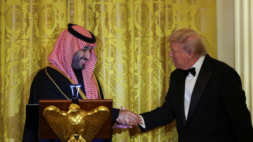 U.S. President Donald Trump greets Saudi Crown Prince and Prime Minister Mohammed bin Salman, during a dinner at the White House in Washington, D.C., U.S., November 18, 2025. REUTERS/Tom Brenner     TPX IMAGES OF THE DAY