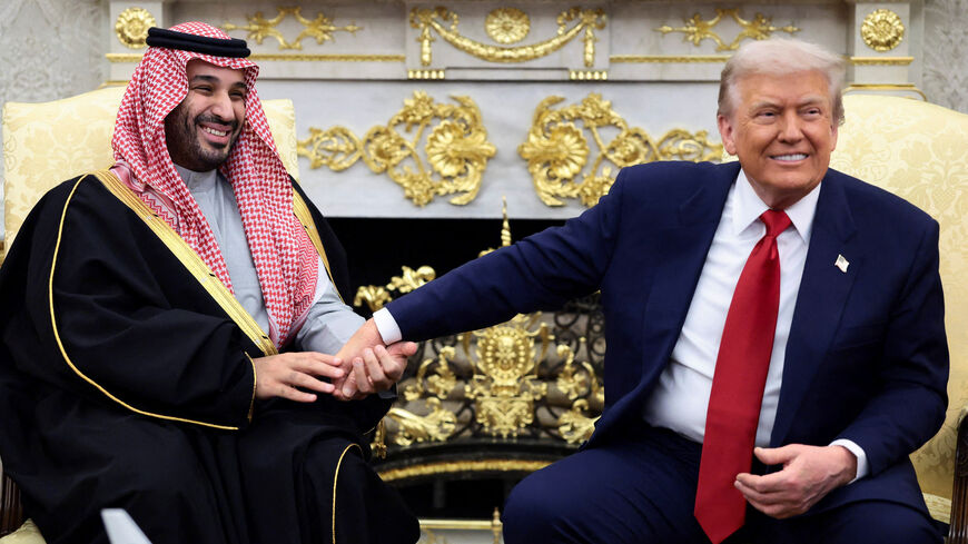 Saudi Crown Prince and Prime Minister Mohammed bin Salman holds President Donald Trump's hand during a meeting in the Oval Office. REUTERS/Evelyn Hockstein