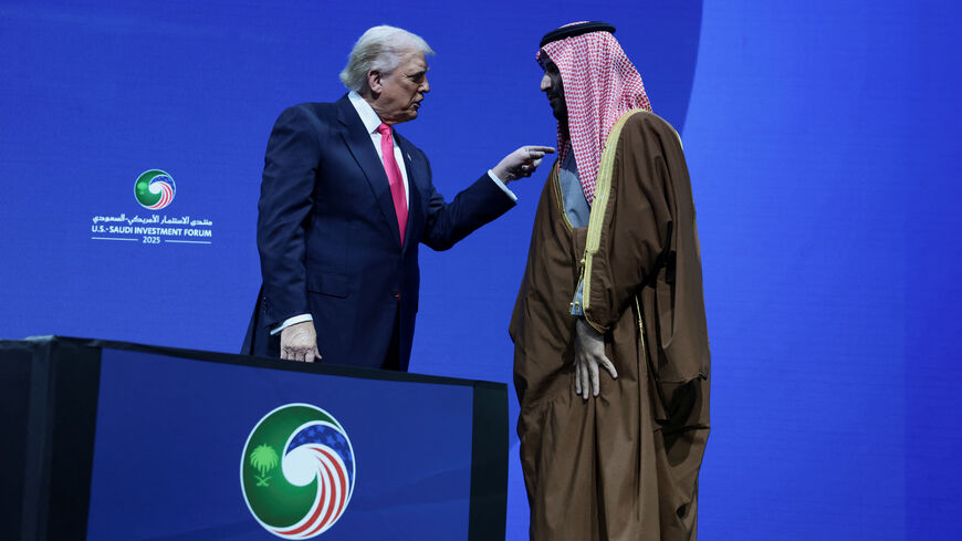 U.S. President Donald Trump and Crown Prince and Prime Minister Mohammed bin Salman of Saudi Arabia interact during the U.S.-Saudi Investment Forum in Washington, D.C., U.S., November 19, 2025. REUTERS/Evelyn Hockstein