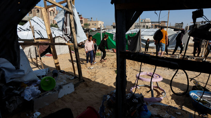 Palestinians inspect the site of Wednesday's Israeli strike on a tents in Al Mawasi, Khan Younis, in the southern Gaza Strip, November 20, 2025. REUTERS/Ramadan Abed