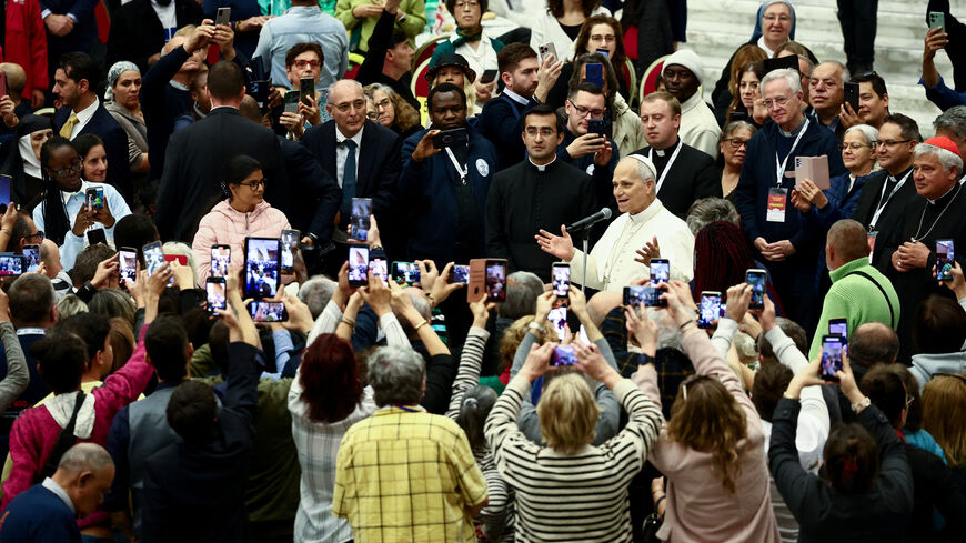 Pope Leo XIV speaks on the day he participates in a lunch with poor people, on World Day of the Poor, in Paul VI Hall at the Vatican, November 16, 2025. REUTERS/Yara Nardi