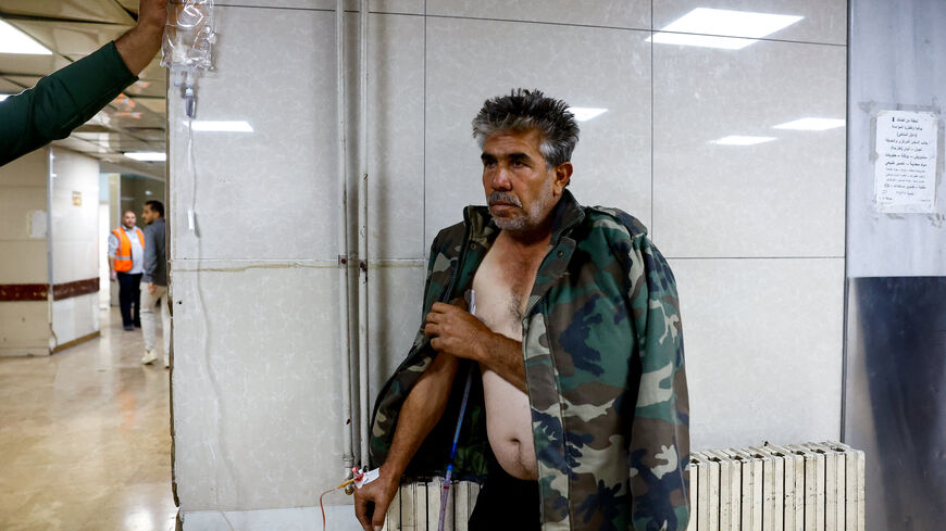 A casualty receives medical treatment inside a hospital, following an Israeli raid in the Beit Jinn area of southern Syria, according to Syrian state media, in Damascus, Syria, November 28, 2025. REUTERS/Yamam al Shaar