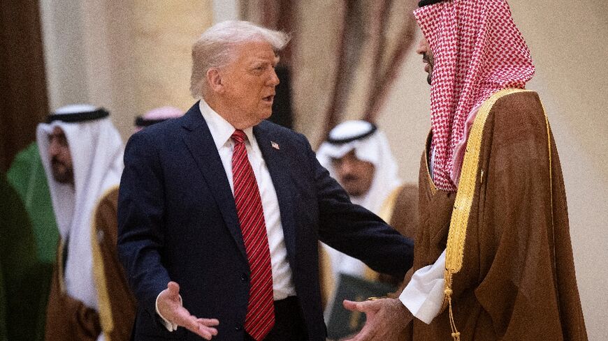 Trump (L) met Saudi Crown Prince Mohammed bin Salman in Riyadh in May