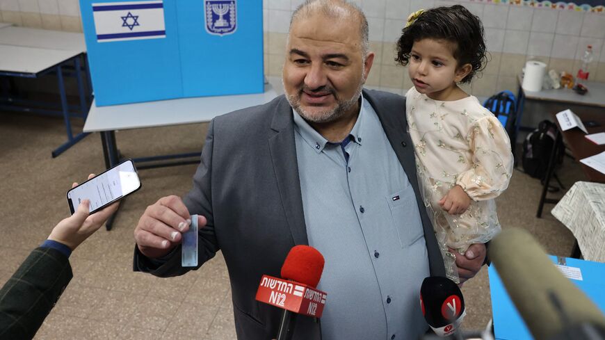 Mansour Abbas, head of Israel's conservative Islamic Raam party, speaks to the press before casting his ballot at a polling station in the northern Israeli village of Maghar on November 1, 2022. - Israelis began voting in their fifth election in less than four years, with veteran leader Benjamin Netanyahu campaigning for a comeback alongside far-right allies. (Photo by AHMAD GHARABLI / AFP) (Photo by AHMAD GHARABLI/AFP via Getty Images)