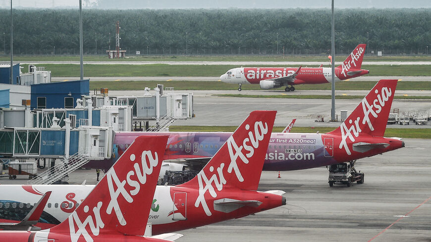 AirAsia airplanes are pictured on the tarmac at Kuala Lumpur International Airport in Sepang on Jan. 8, 2024. 