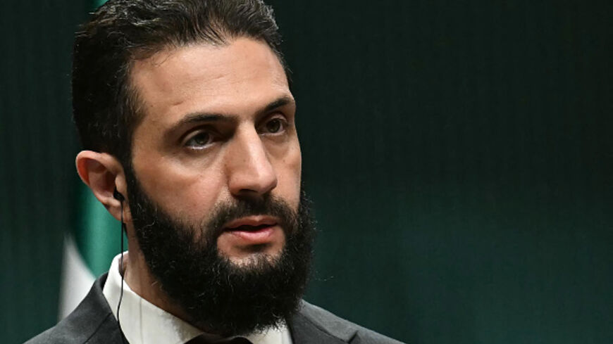 Syria's interim president Ahmed al-Sharaa holds a joint press conference with the Turkish president following their meeting at the Presidential Palace in Ankara, on February 4, 2025. Syria's interim president is in Turkey for talks with the country's leader after flying in from Saudi Arabia, where he was seeking help from wealthy Gulf countries to finance the reconstruction of his war-ravaged nation and revive its economy, as part of his second international trip since ousting the former Syrian president. (