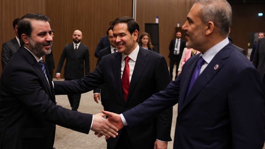 Turkish Foreign Minister Hakan Fidan (R) shakes hands with Syrian Foreign Minister Asaad Hassan al-Shibani and US Secretary of State Marco Rubio (C) at the NEST International Convention Center, in Antalya on May 15, 2025. (UMIT BEKTAS/AFP via Getty Images)