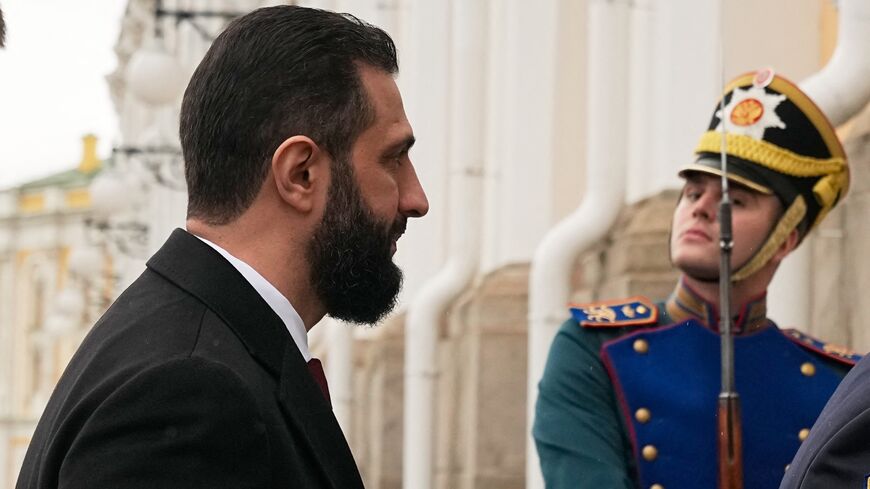 Syrian interim President Ahmed al-Sharaa arrives at the Grand Kremlin Palace for his meeting with Russia's president in Moscow on Oct. 15, 2025. 