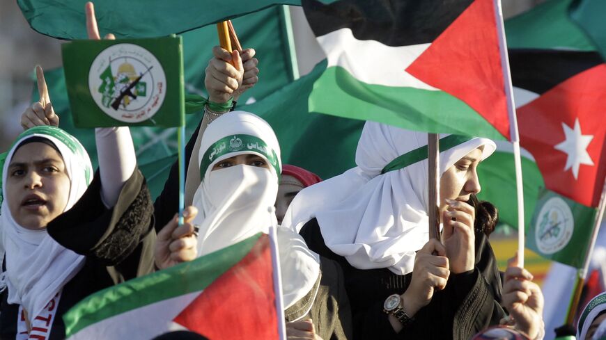 Jordanian supporters of the Muslim Brotherhood wave the Palestinian flag as they gather during a protest to celebrate the "Gaza victory" in the war against Israel, in the capital Amman, on Aug. 8, 2014. 