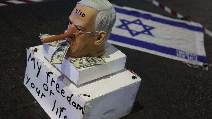 A mask of mocking Israeli Prime Minister Benjamin Netanyahu during a demonstration in Tel Aviv