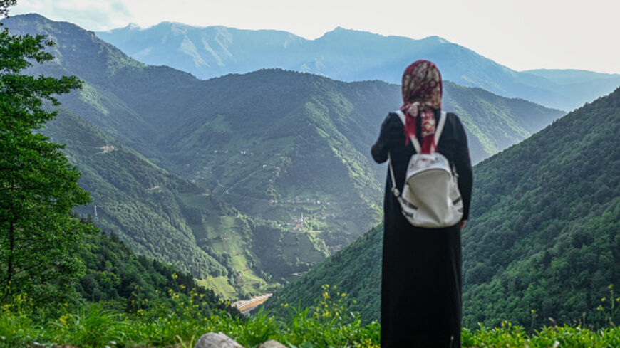 A villager stands at a high point to survey the damage to the hill sides by quarrying in Ikizdere in the Rize Province in the Black Sea region of Turkey on June 7, 2021. 