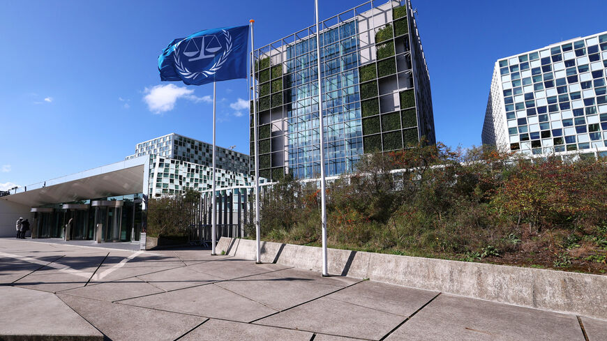 People stand outside the International Criminal Court (ICC) as the United States is considering imposing sanctions as soon as this week against the entire International Criminal Court, in The Hague, Netherlands, September 22, 2025. REUTERS/Piroschka van de Wouw
