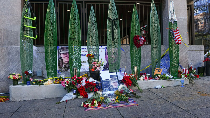 A makeshift memorial at the site of a shooting of two National Guard members in Washington, U.S., December 1, 2025. REUTERS/Aaron Schwartz