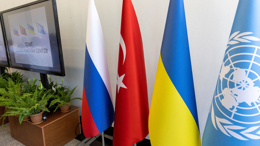 FILE PHOTO: National flags of Russia, Ukraine, Turkey and a U.N. flag are seen during the opening ceremony of a joint coordination centre (JCC) that will oversee a U.N.-brokered deal to re-open Ukrainian grain exports in the Black Sea, in Istanbul, Turkey, July 27, 2022. REUTERS/Umit Bektas/File Photo
