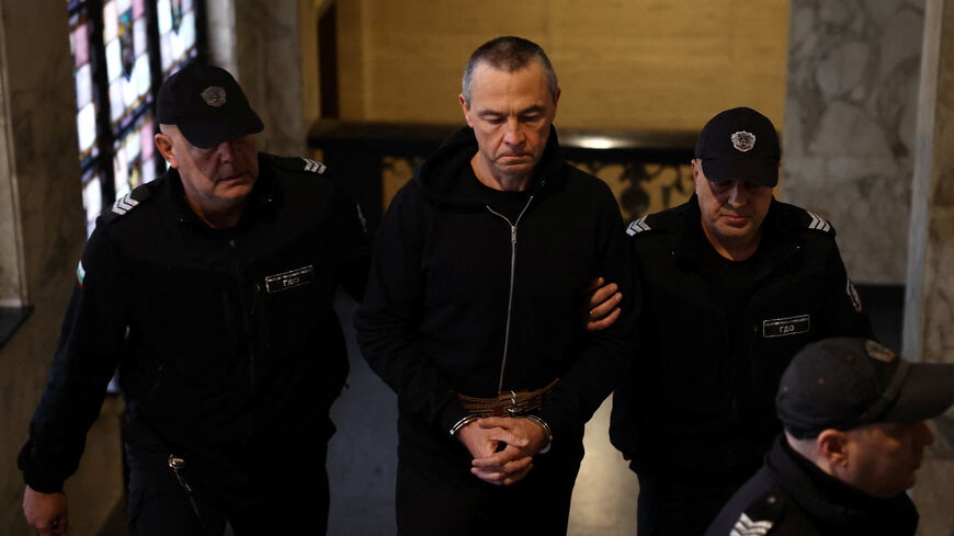 Igor Grechushkin, a Russian businessman based in Cyprus, is escorted by police before the start of his trial on the possible extradition to Lebanon, in Sofia, Bulgaria, December 10, 2025. REUTERS/Stoyan Nenov