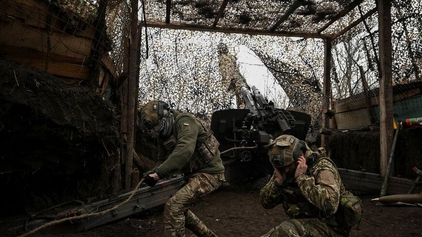 Artillerymen of the 152nd Separate Jaeger Brigade fire a howitzer towards Russian troops, amid Russia's attack on Ukraine, near the frontline town of Pokrovsk in Donetsk region, Ukraine December 11, 2025. REUTERS/Stringer