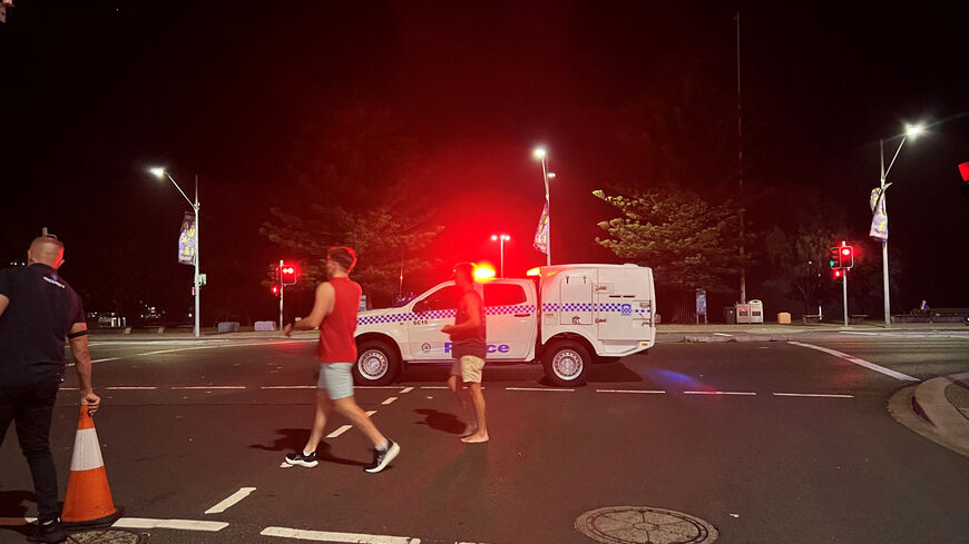 People walk at the scene of a shooting incident at Bondi Beach, Sydney, Australia, December 14, 2025. REUTERS/Kirsty Needham