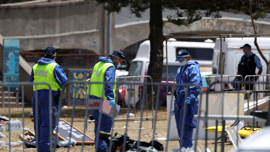 Members of the forensic team work at the scene of a shooting during a Jewish holiday celebration at Bondi Beach, in Sydney, Australia, December 15, 2025. REUTERS/Hollie Adams
