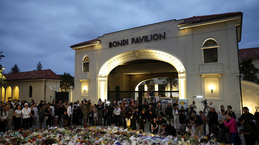 People pay respects at Bondi Pavilion to victims of a shooting during a Jewish holiday celebration at Bondi Beach, in Sydney, Australia, December 15, 2025. REUTERS/Hollie Adams