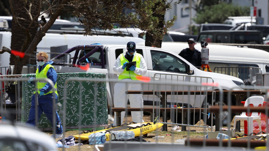 Members of the forensic team work at the scene of a shooting during a Jewish holiday celebration at Bondi Beach, in Sydney, Australia, December 15, 2025. REUTERS/Hollie Adams