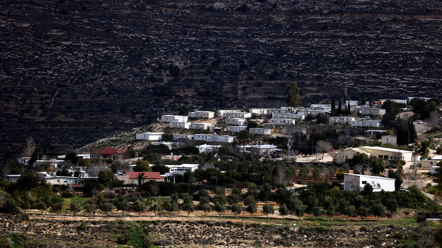 A view shows homes in the Jewish settlement of Givat Harel, taken from the Jewish settlement of Givat Haroeh in the Israeli-occupied West Bank, February 21, 2023. REUTERS/Ronen Zvulun